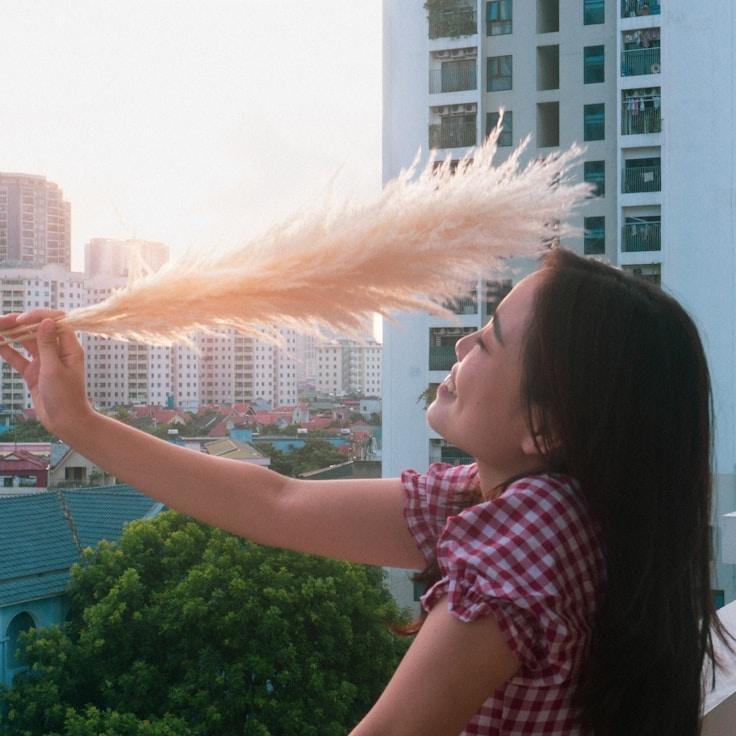 Kaveri Mehta, Lead Design Curator at True Vector Works, reviewing corporate floral arrangements